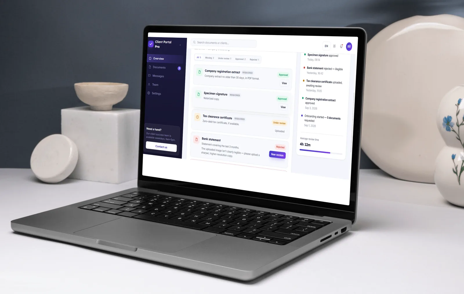 Client Portal document checklist with approved, under review and rejected documents on a laptop